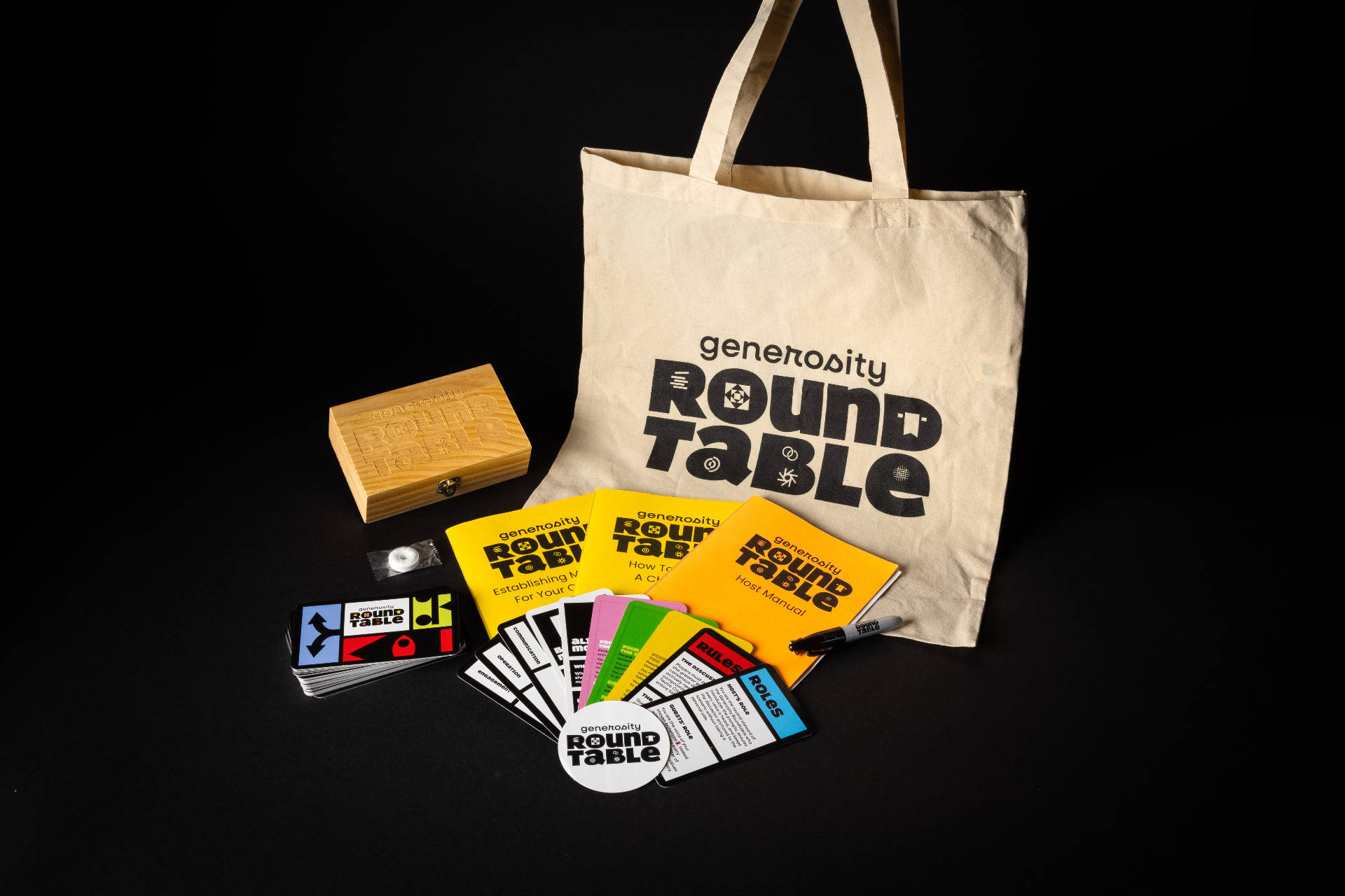 The Generosity Roundtable Pilot Edition set: wooden box, tote bag, cards, booklets, and sticker