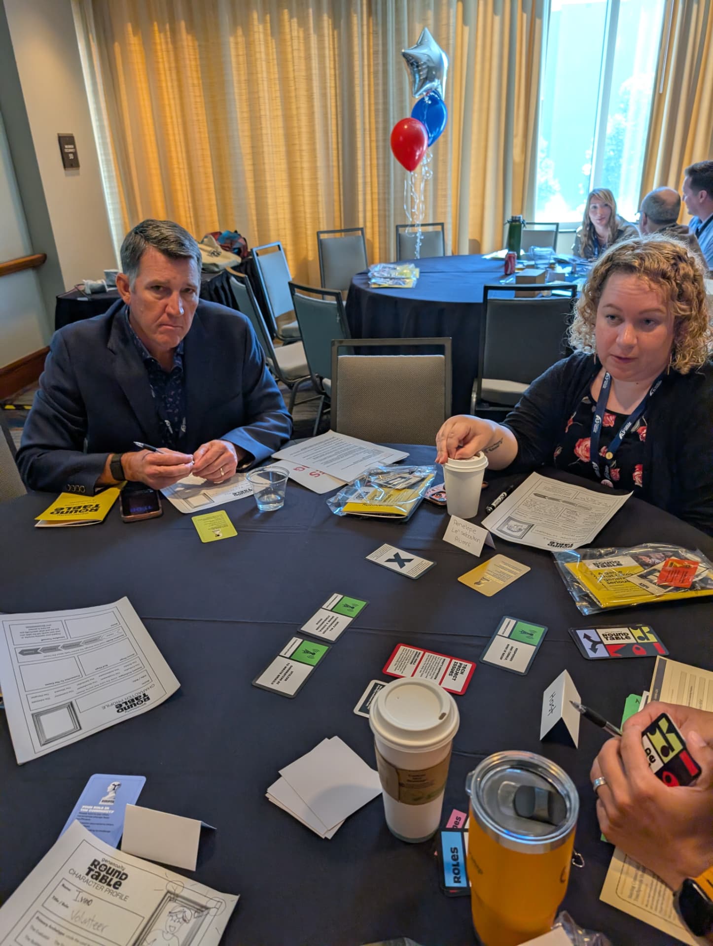 Character profiles and conversation cards in play at the Association of Leadership Programs National Conference.