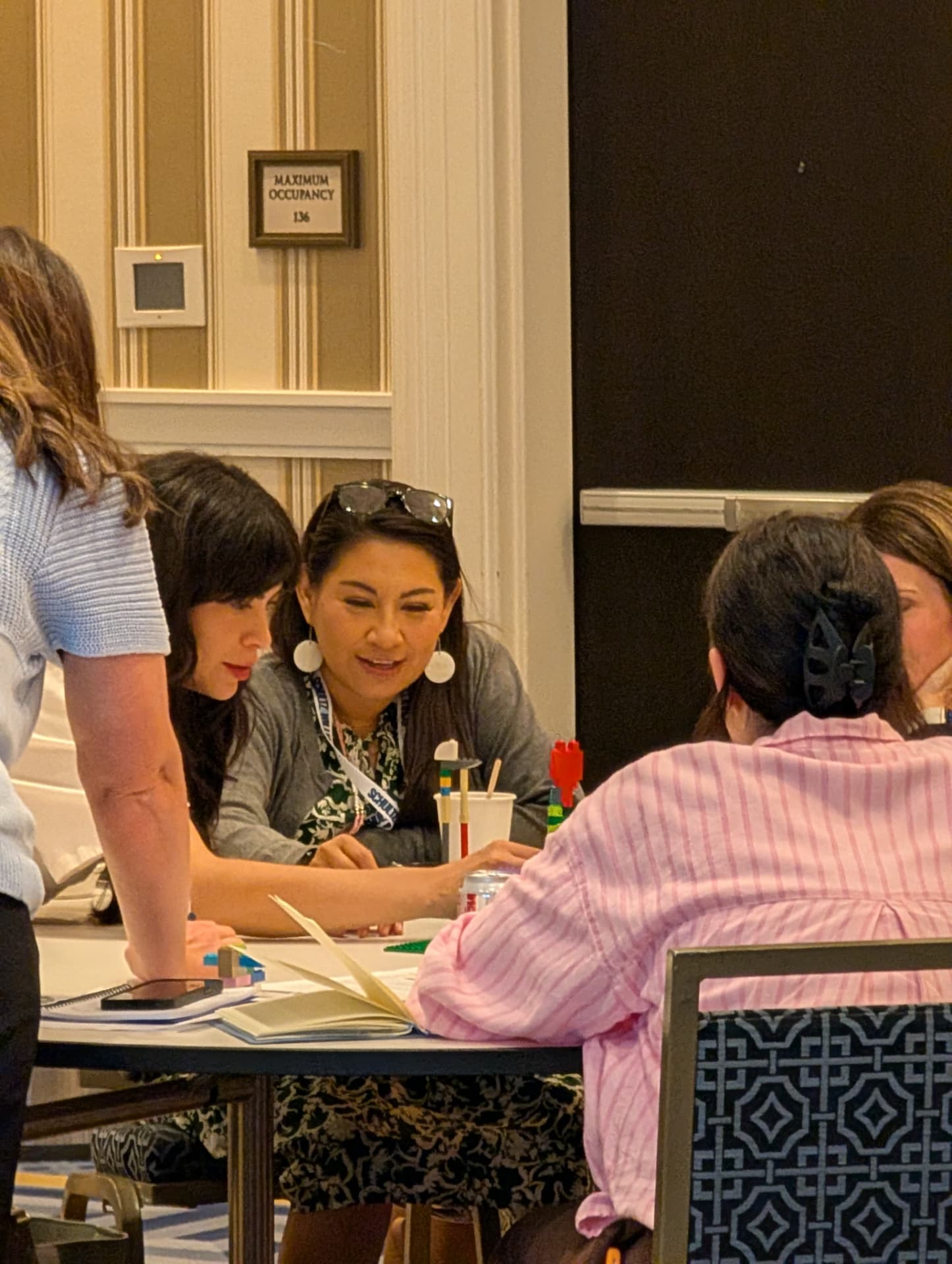 Two players comparing notes mid-round during the Bridge Conference workshop.